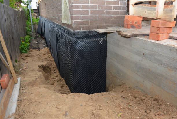 SJ Waterproofing Pros technician performing targeted Waterproofing assessment in Wilmette, IL